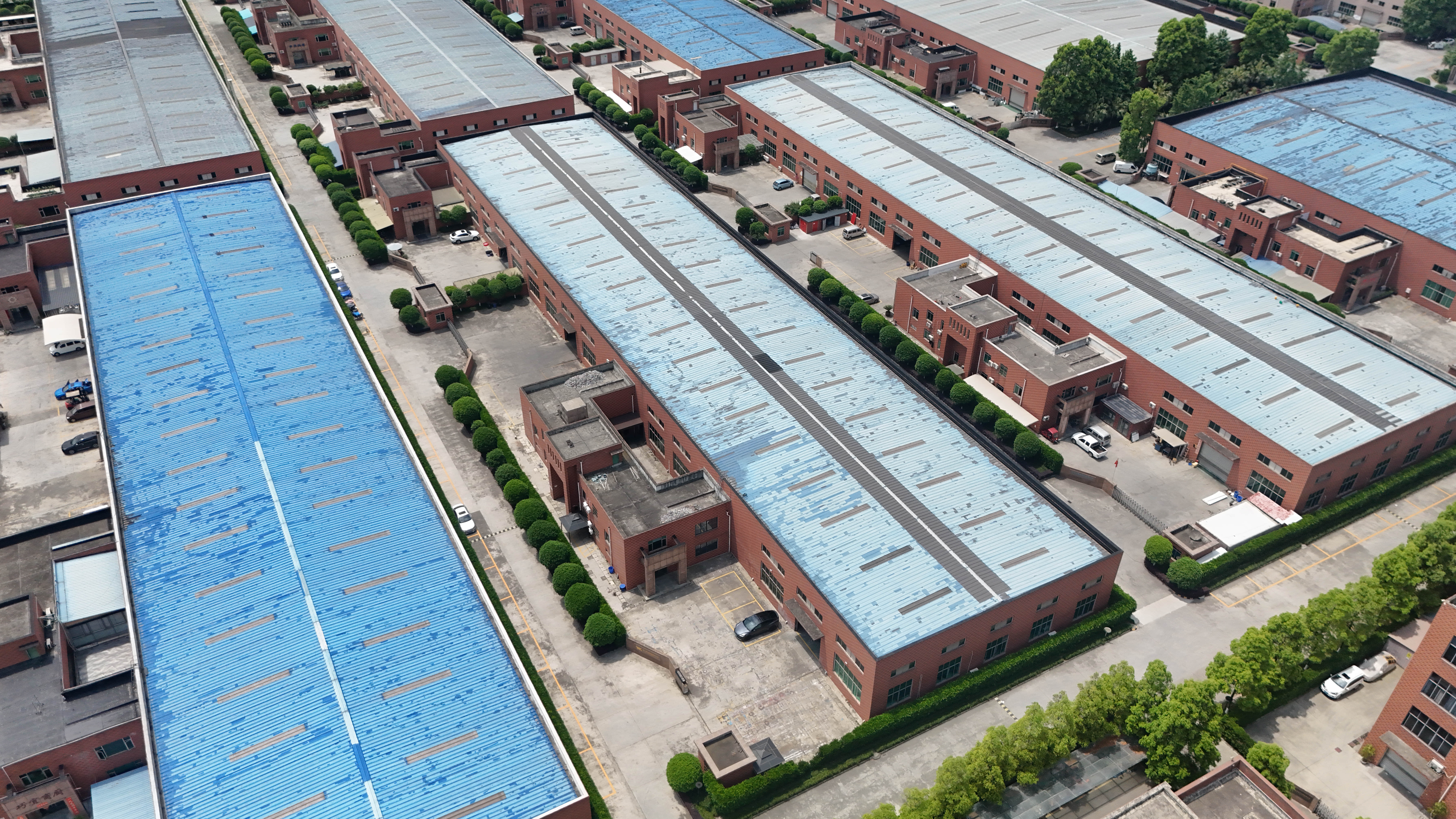 Aerial view of the factory site with several production buildings