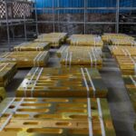 Warehouse stack of factory-direct crusher wear parts ready for shipment